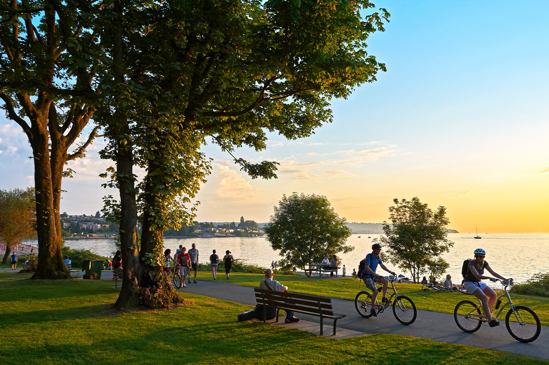 Young people biking, walking at Stanley Park